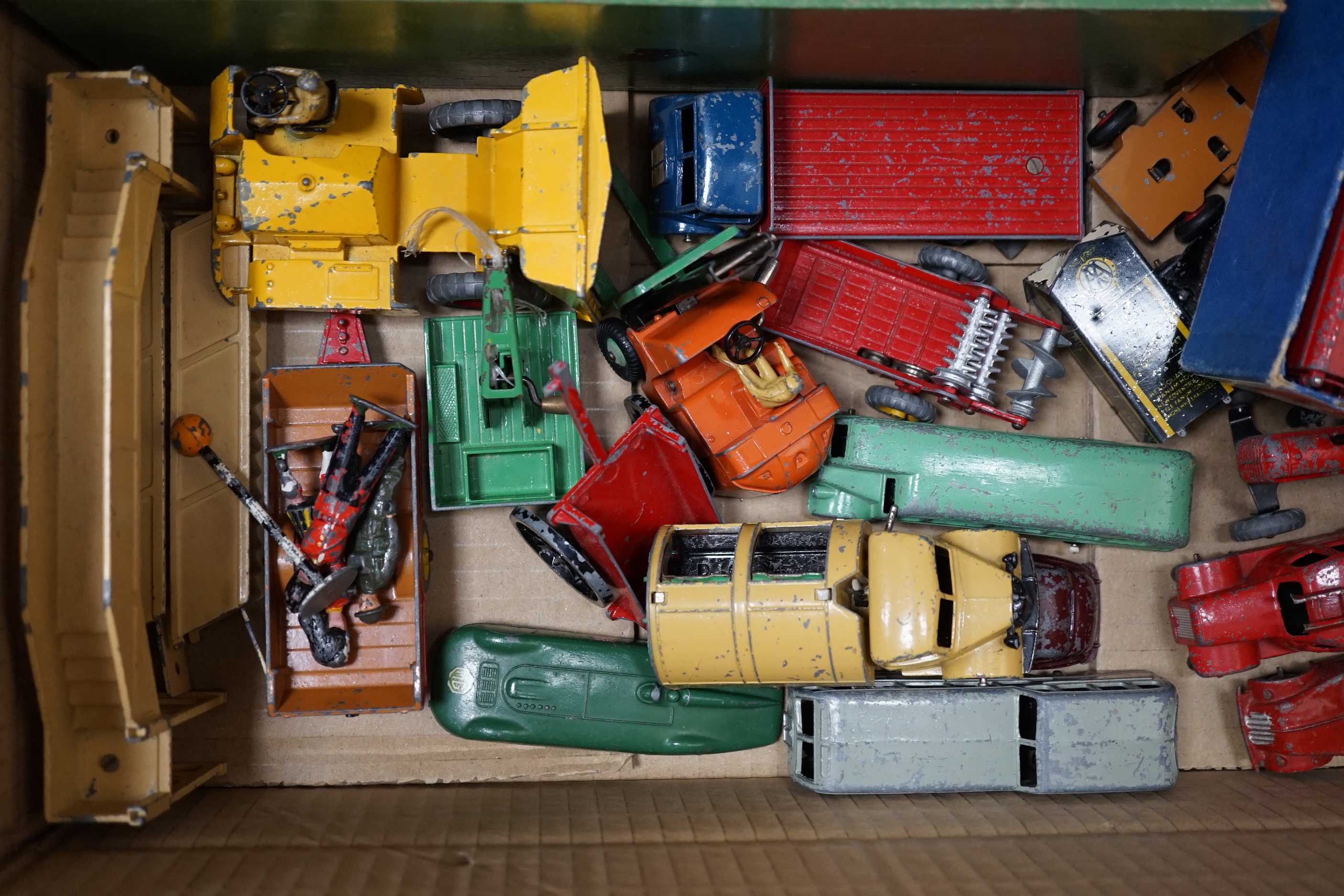 Twenty Dinky Toys and Supertoys including two Guy vans (514); Lyons and Slumberland, two taxis, a Vanguard, Daimler ambulance, Bedford refuse lorry, Guy Flatbed, M.G. Record car, etc. together with a quantity of assorted